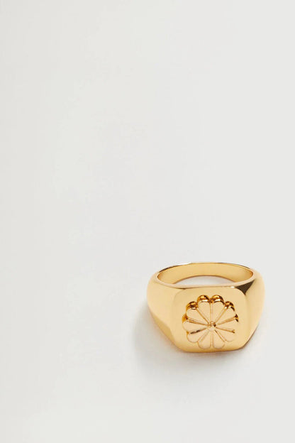 Gold ring with raised flower design