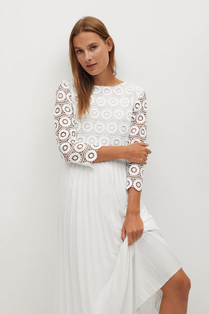 White lace long-sleeve midi dress with circular pattern bodice and gathered skirt