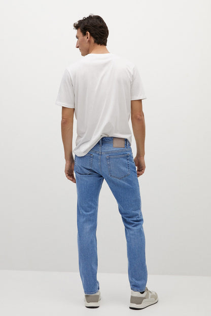 MANGO medium-blue denim jeans, back view with yoke and rear pockets, straight leg