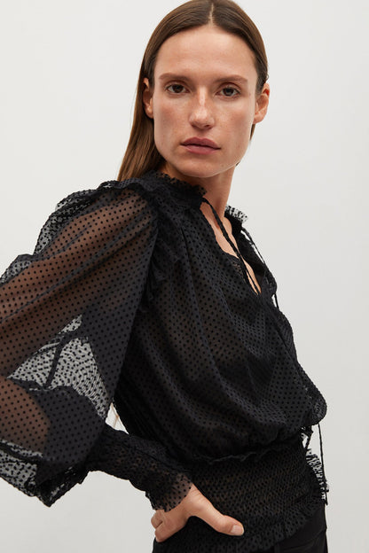 Black sheer dotted blouse with ruffle-trim V-neck and long puff sleeves