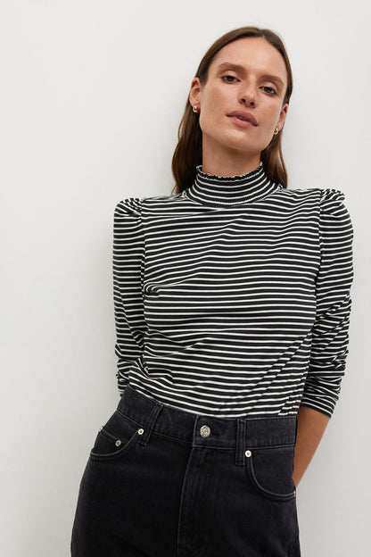 Striped turtleneck top in off-white and dark fabric with long sleeves