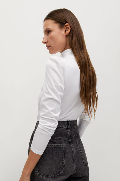 White long-sleeve turtleneck sweater with high ribbed neck