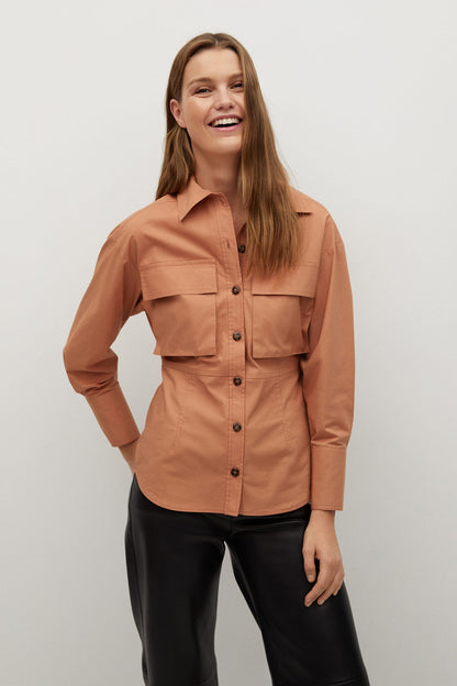 Peach button-up shirt with long sleeves and front button placket