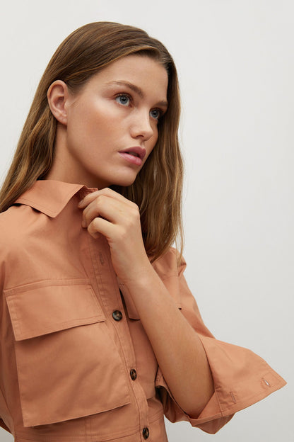 Peach button-up shirt with pointed collar and chest flap pockets