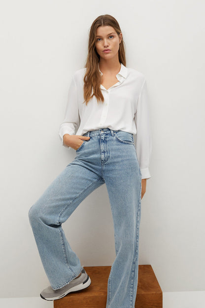Off-white button-up blouse with pointed collar and long sleeves
