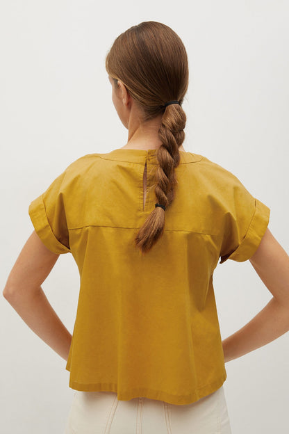 Mustard yellow blouse back view with gathered yoke and short puff sleeves