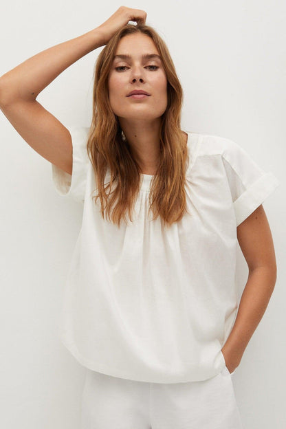 White short-sleeve blouse with gathered neckline and loose fit