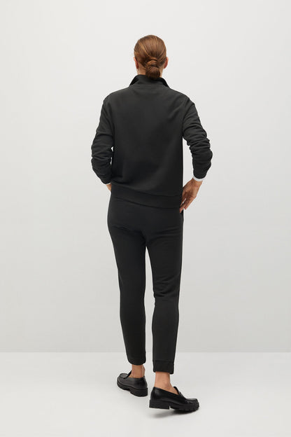 Charcoal tapered track pants, rear view with ankle cuffs