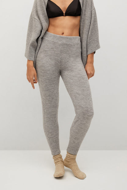 Grey knit lounge pants with ribbed ankle cuffs and tapered leg