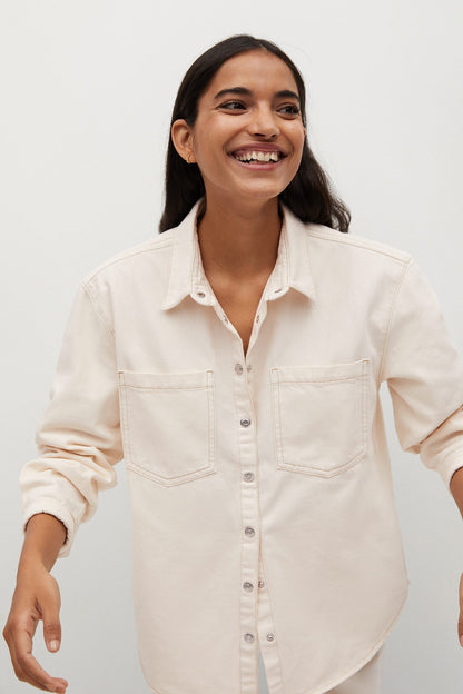 Ecru button-up shirt with long sleeves, button front, and chest pockets