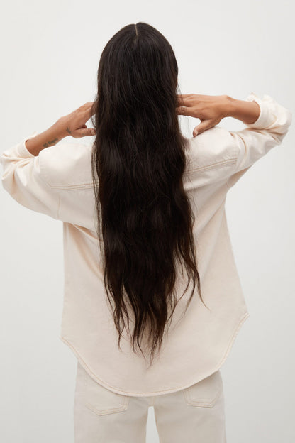 Ecru button-up shirt back view with long sleeves and curved hem