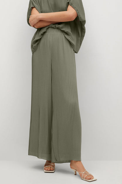 MANGO olive pleated wide-leg trousers and draped top, side view