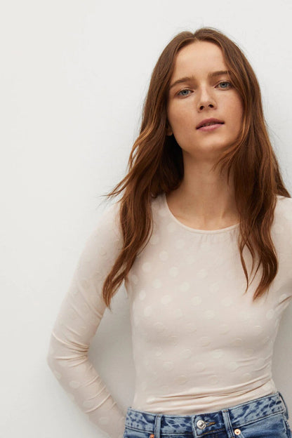 Ecru long-sleeve crew-neck top with subtle dot pattern