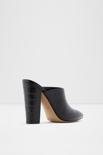 Black heeled mule with pointed toe, block heel, and textured upper