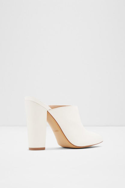 White heeled mule with wide strap detail and tan outsole, square block heel