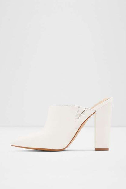 White pointed-toe heeled mule with high block heel and minimal strap
