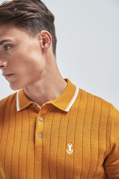 Amber knit polo collar with white trim, button placket, chest logo detail