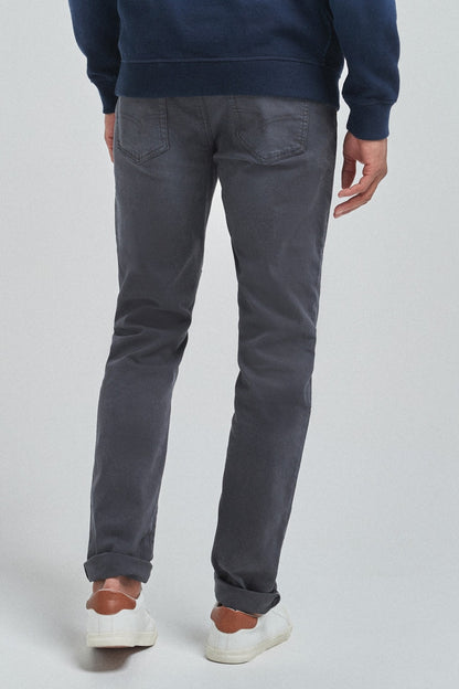 Navy slim jeans with front pockets, belt loops, and cuffed hems