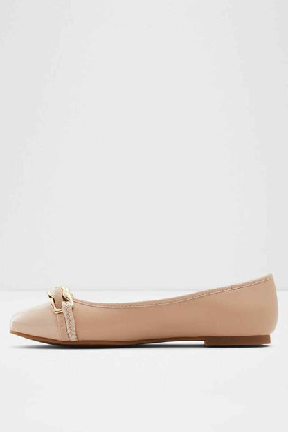 Bone ballet flat, front toe view with gold chain buckle