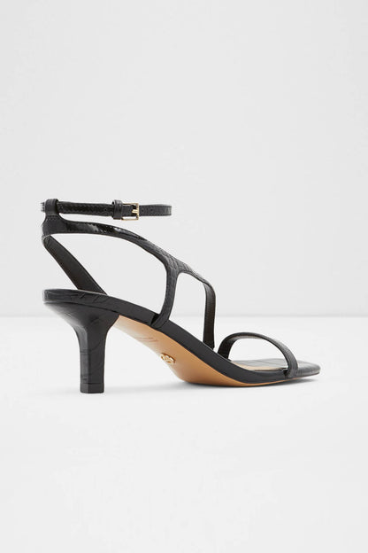 Black heeled sandal with buckled ankle strap and open toe