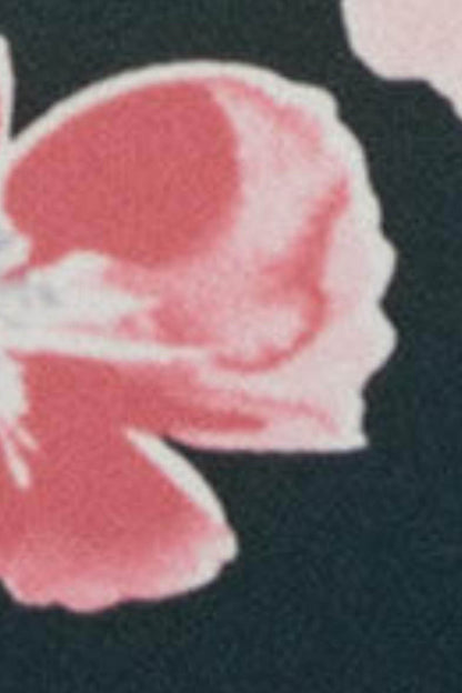 Floral lace-trim fabric on dark briefs, close-up detail