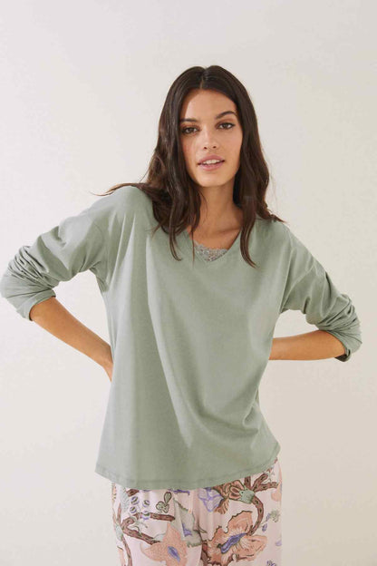 Women's green long-sleeve V-neck top with lace-trim neckline