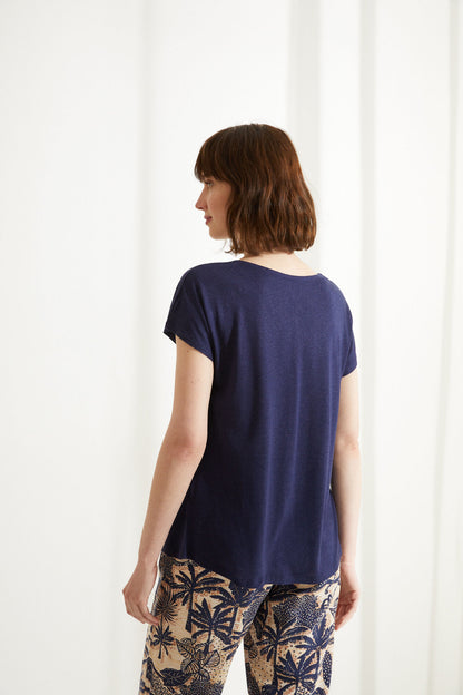 Navy V-neck short-sleeve pajama top and tropical printed pajama pants, back