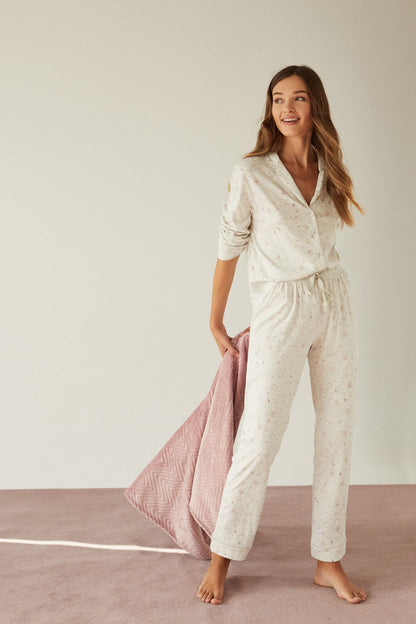 Women's printed pajama set with three-quarter sleeves, button front, elastic waist pants
