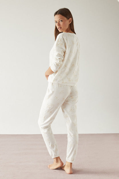 Women's Secret white pajama set with brown print, long sleeves and ankle-length pants