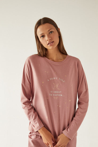 Dusty pink long-sleeve pajama top with moon and star graphic, fairy tale text