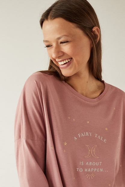 Dusty pink pajama top with moon-and-stars print and crew neckline