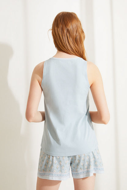 Women'secret light blue sleeveless camisole back view with patterned hem shorts