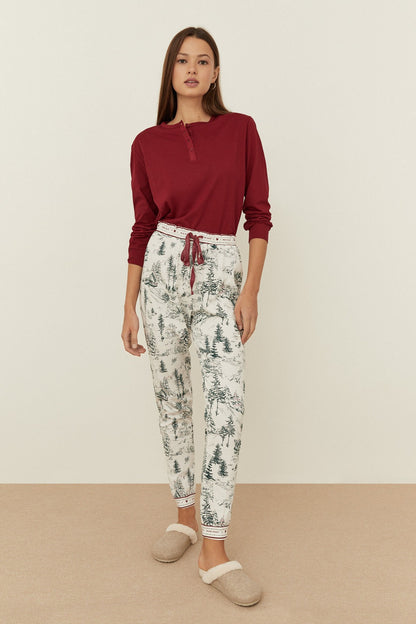 Off-white pajama pants with green tree & deer print, drawstring waist, ankle length