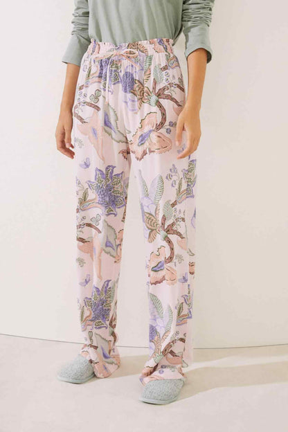 Light pink printed pajama pants with elastic smocked waistband and full-length legs