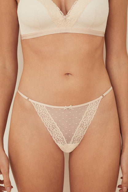 Light beige lace-trim bra and matching dotted mesh briefs, front view