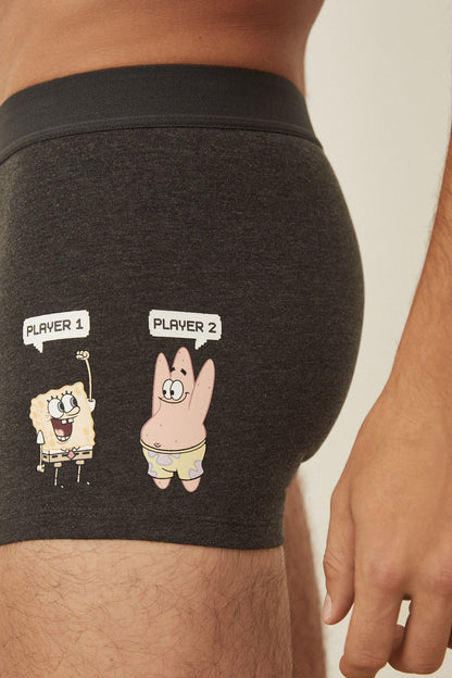 Men's boxer shorts with dark fabric and two cartoon character graphic on side