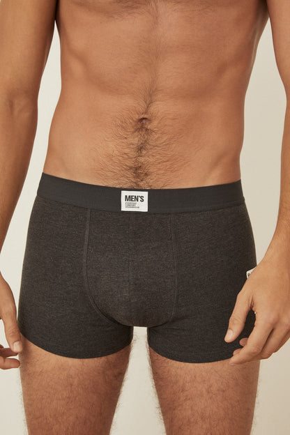 Men's boxer shorts in dark grey with elastic waistband and centered brand label