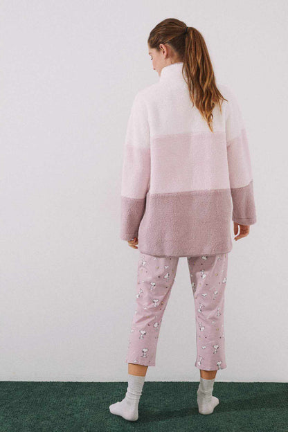 Women's fleece pajama set in pink: zip-up jacket, contrast back panels, patterned pants.