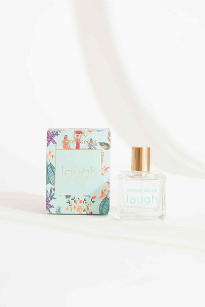Women'secret laugh gift box and clear eau de parfum bottle with gold cap, light blue label