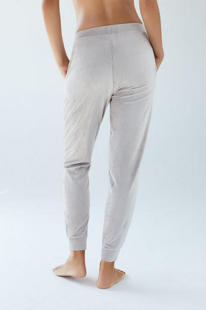Women's lounge jogger pants, back view, light sand/gray with tapered ankles