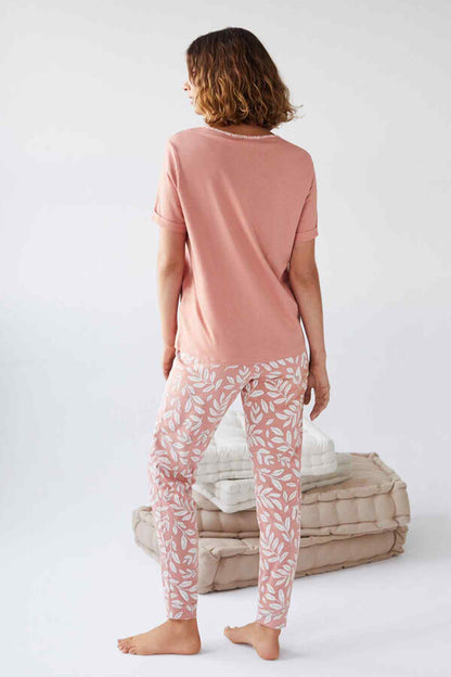 Women'secret pink pajama top from behind with patterned matching pants