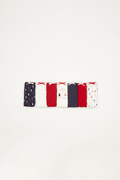 Folded pack of assorted bikini briefs in red, navy, and white patterns