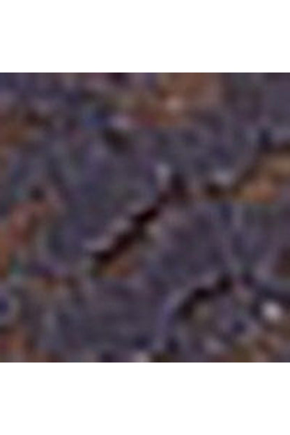 Blurred close-up of dark blue lace fabric detail