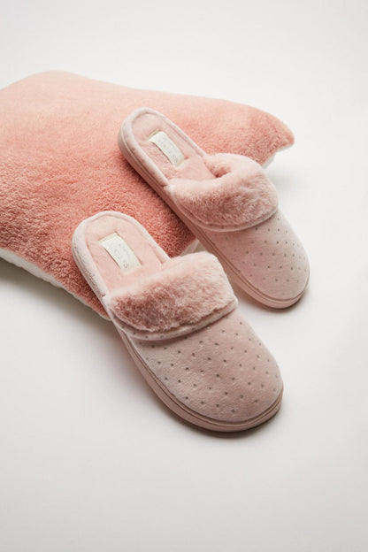 Pink plush slide slippers with strap detail and dotted fabric lining