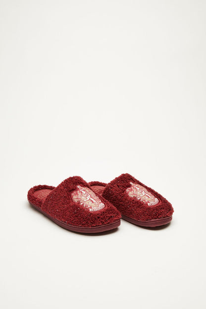 Dark red fuzzy slide slippers with embroidered crest on vamp