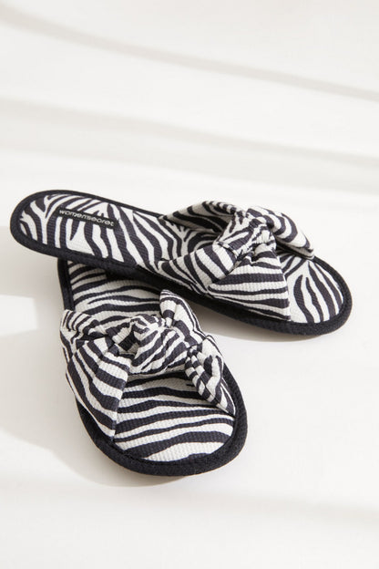 Zebra-striped slide slippers with knotted strap and textured sole