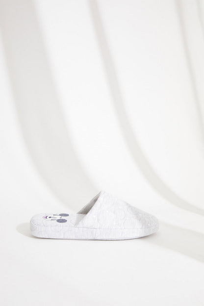 Light grey quilted open-back slippers with small cartoon paw patch