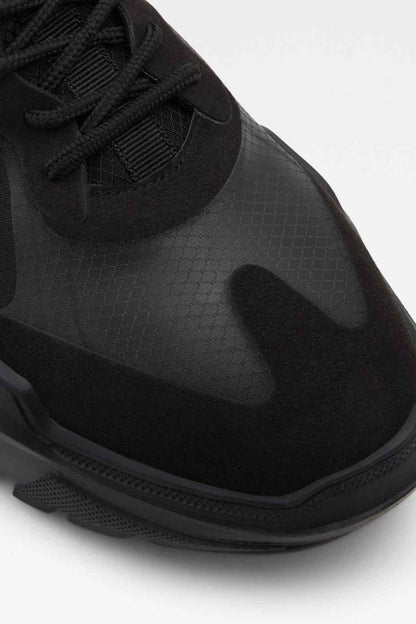 ALDO black sneaker close-up of knit upper, laces, and textured sole edge