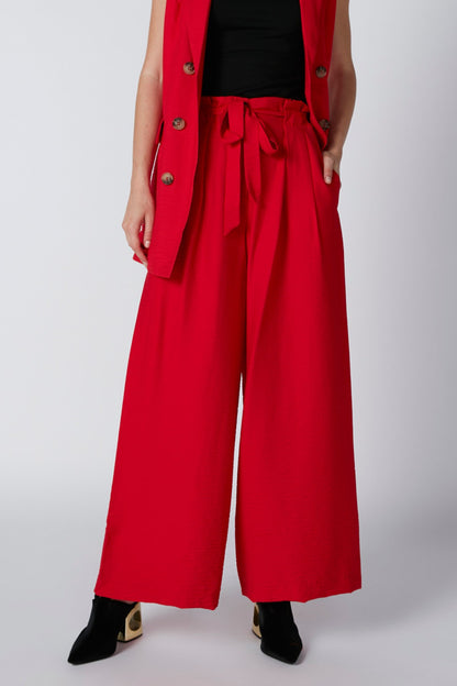 Red wide-leg trousers with drawstring waist and front crease