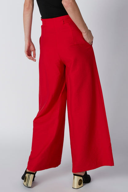 Red high-waist wide-leg trousers with side seam detail